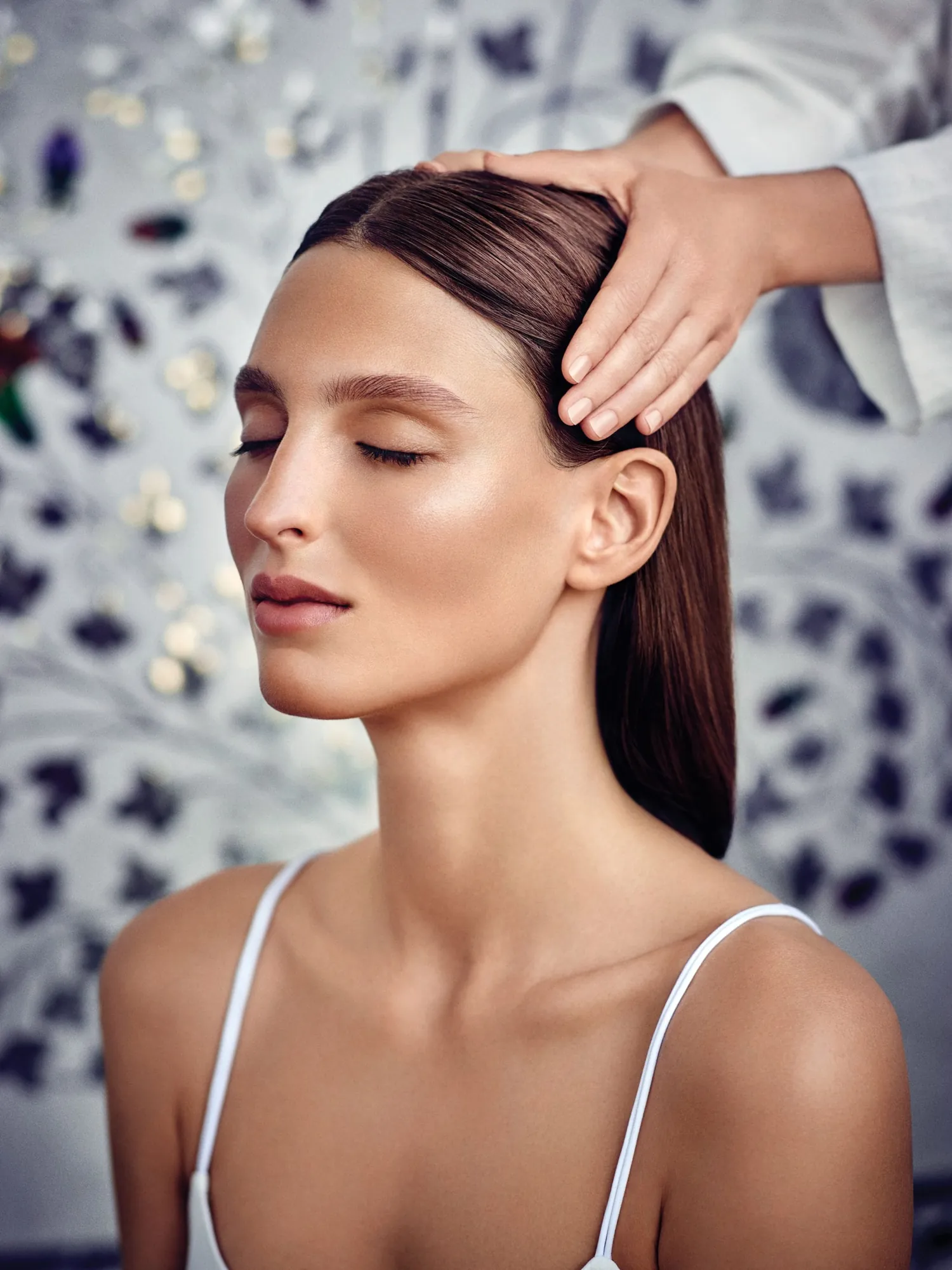 A guest with eyes closed during an Aveda scalp ritual